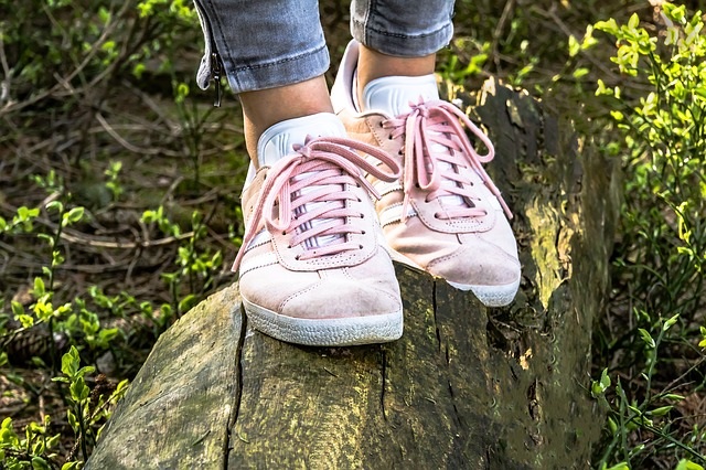 Woman walking on log.