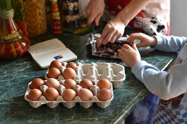 Adult and child baking